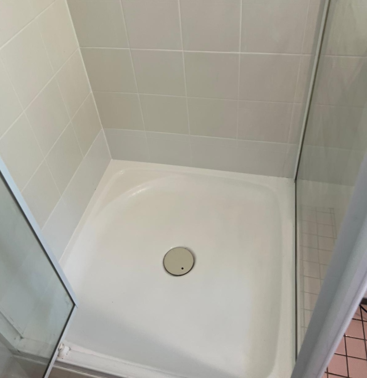 Gold Coast shower regrouting - before: old, cracked grout with mould and water damage