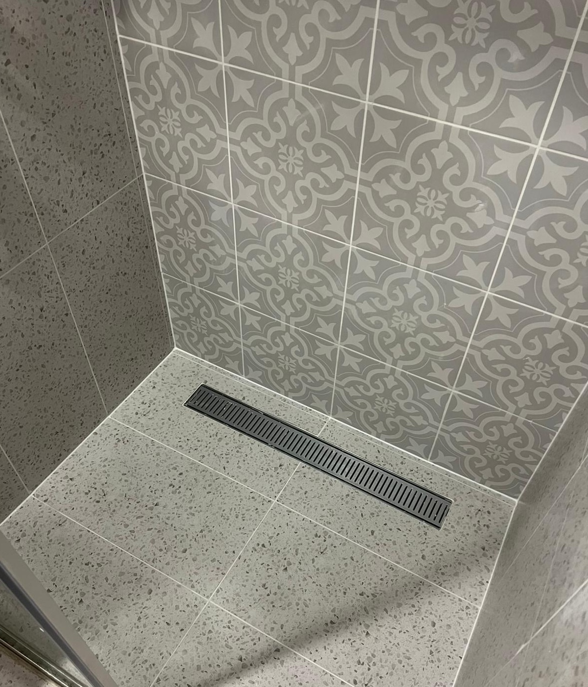 Gold Coast shower regrouting - before: old, cracked grout with mould and water damage